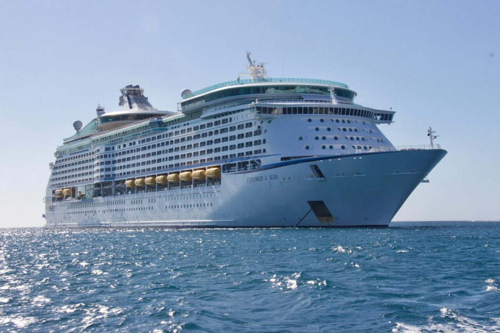 pexels-photo-813011-813011 A luxurious cruise ship sailing on the ocean under a clear blue sky, ideal for travel and leisure.